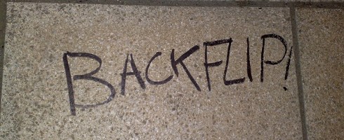 Photo of the word "backflip" written on walkway wall, Leeds (England).